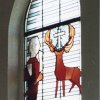 1965 Hubertushirsch im Fenster der Pfarrkirche Rövenich